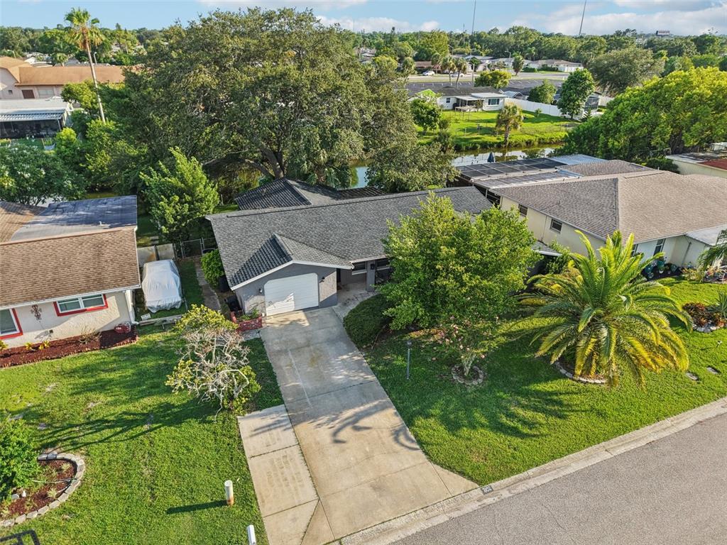 7102 Cherry Laurel Drive Port Richey, FL 34668 - Photo 33 of 39 an aerial view of a house with a yard