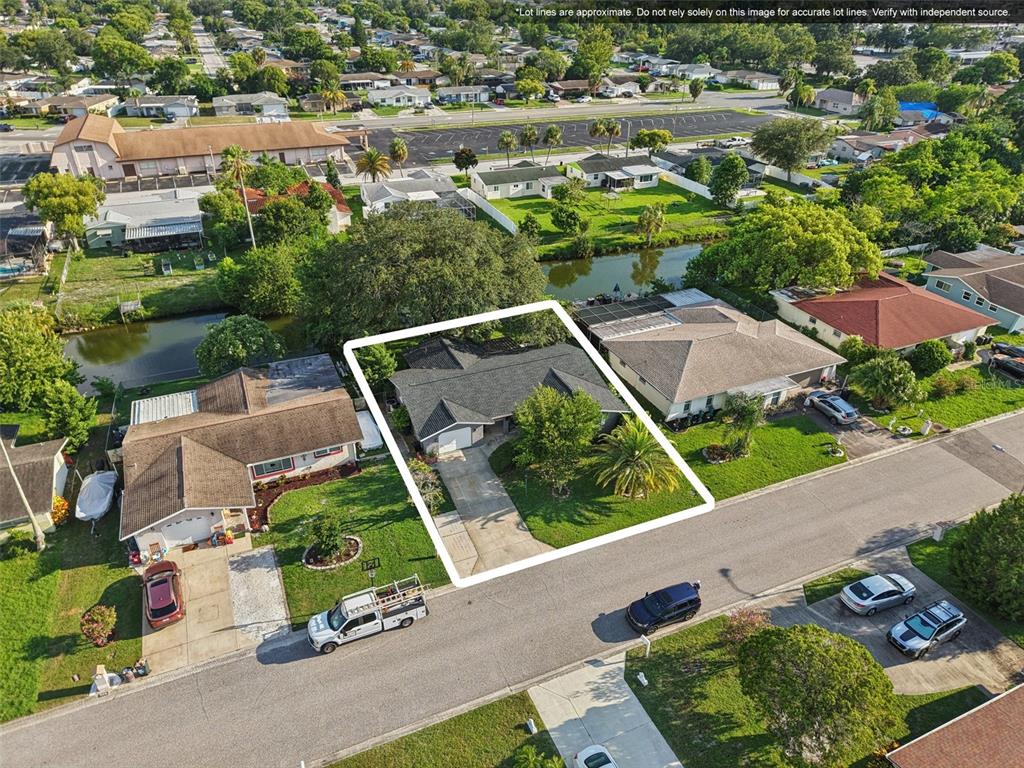 7102 Cherry Laurel Drive Port Richey, FL 34668 - Photo 34 of 39 an aerial view of multiple houses with yard