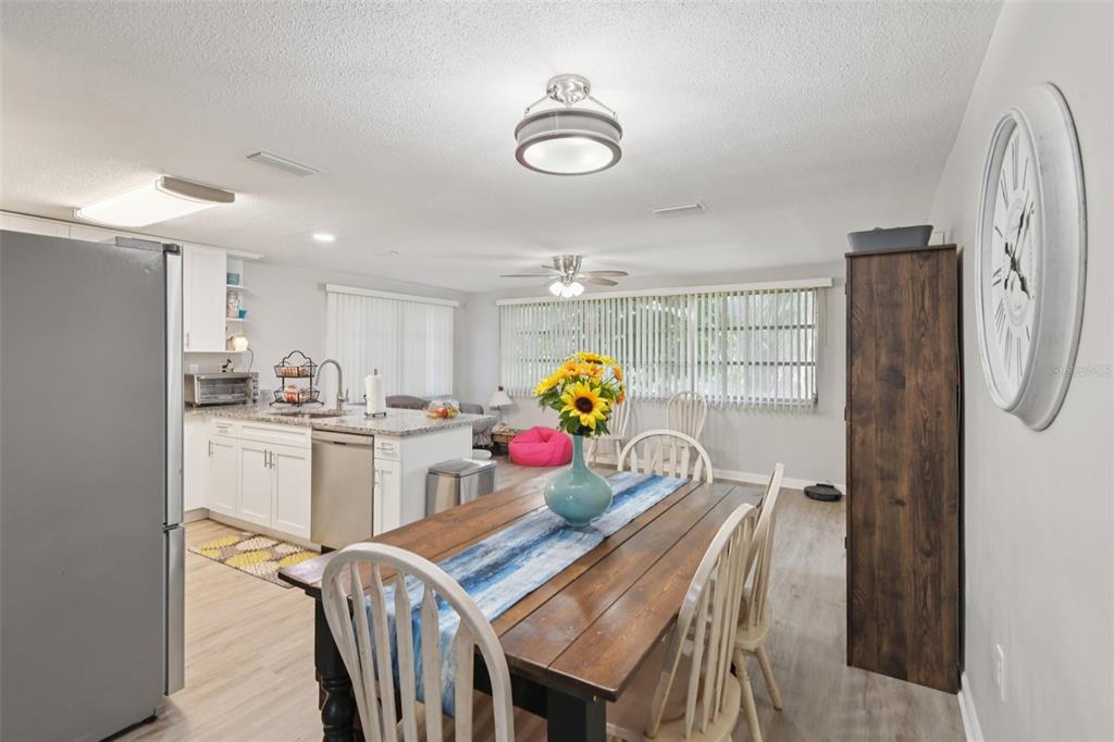 7102 Cherry Laurel Drive Port Richey, FL 34668 - Photo 5 of 39 a kitchen with stainless steel appliances granite countertop a refrigerator and microwave