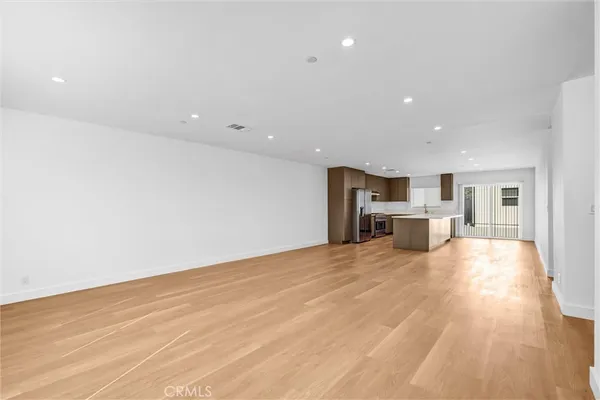 a view of kitchen with wooden floor