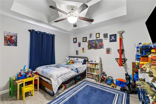 a bed room with a bed and a desk