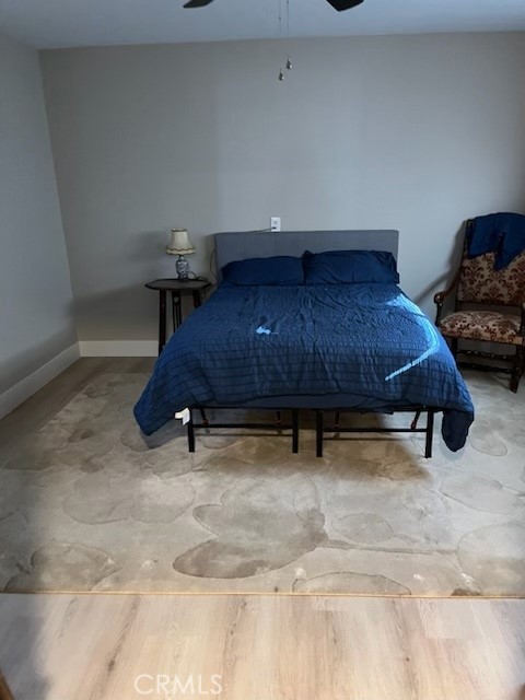 18110 Ave Bosque Murrieta, CA 92562 - Photo 12 of 20 a room with a table chair and a wooden floor