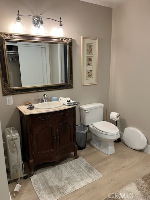 18110 Ave Bosque Murrieta, CA 92562 - Photo 15 of 20 a bathroom with a toilet sink and mirror