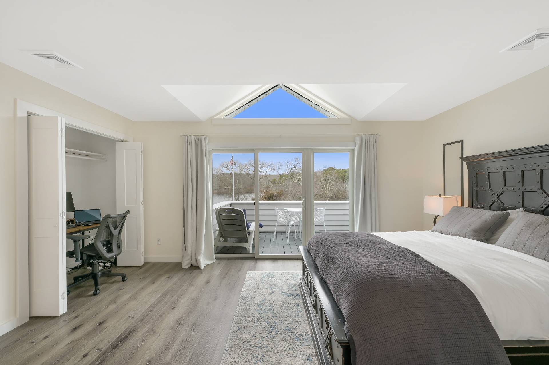 Undisclosed Address Westhampton, NY 11977 - Photo 12 of 18 a bedroom with a bed and a large window