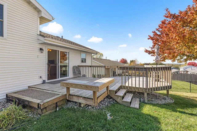 a view of a patio with a table and chairs