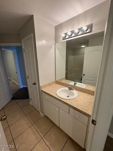 a bathroom with a sink and a mirror