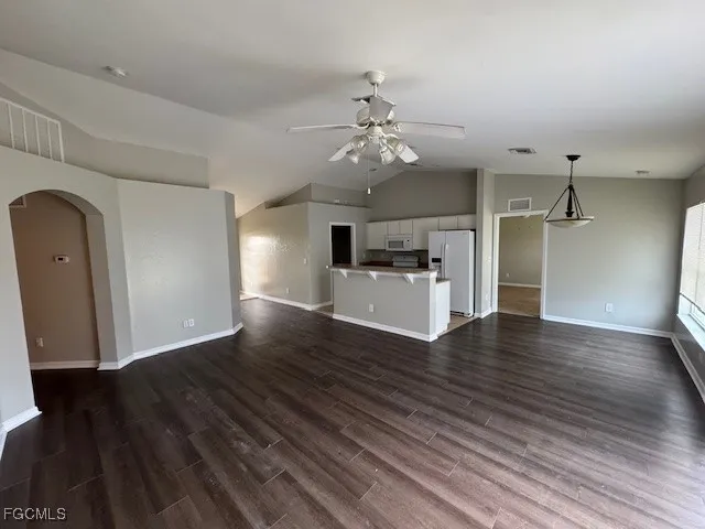 a view of a livingroom with wooden floor