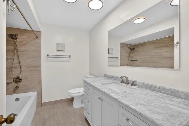 a close view of a sink and a stove in a kitchen