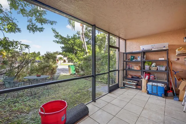 a backyard of a house with yard and outdoor seating