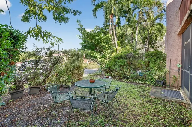 front view of a house with a cars parked in front of it