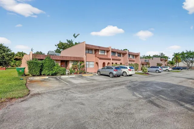 a view of a swimming pool with a yard