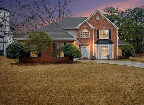 front view of a house with a yard