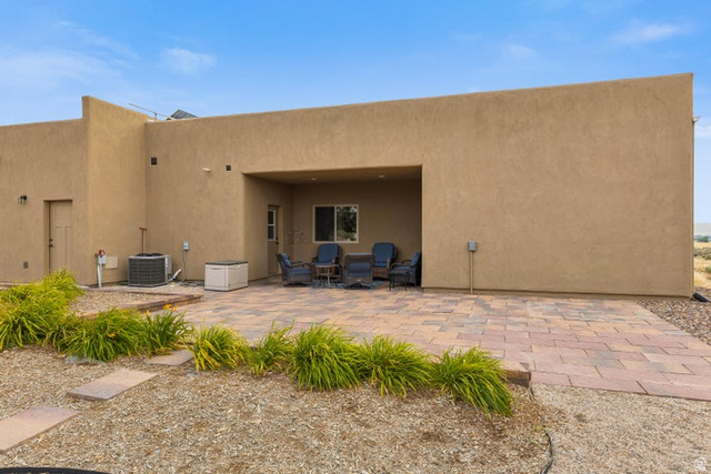 2925 Juniper Road Enterprise, UT 84725 - Photo 36 of 56 Back of house with a patio and stucco siding