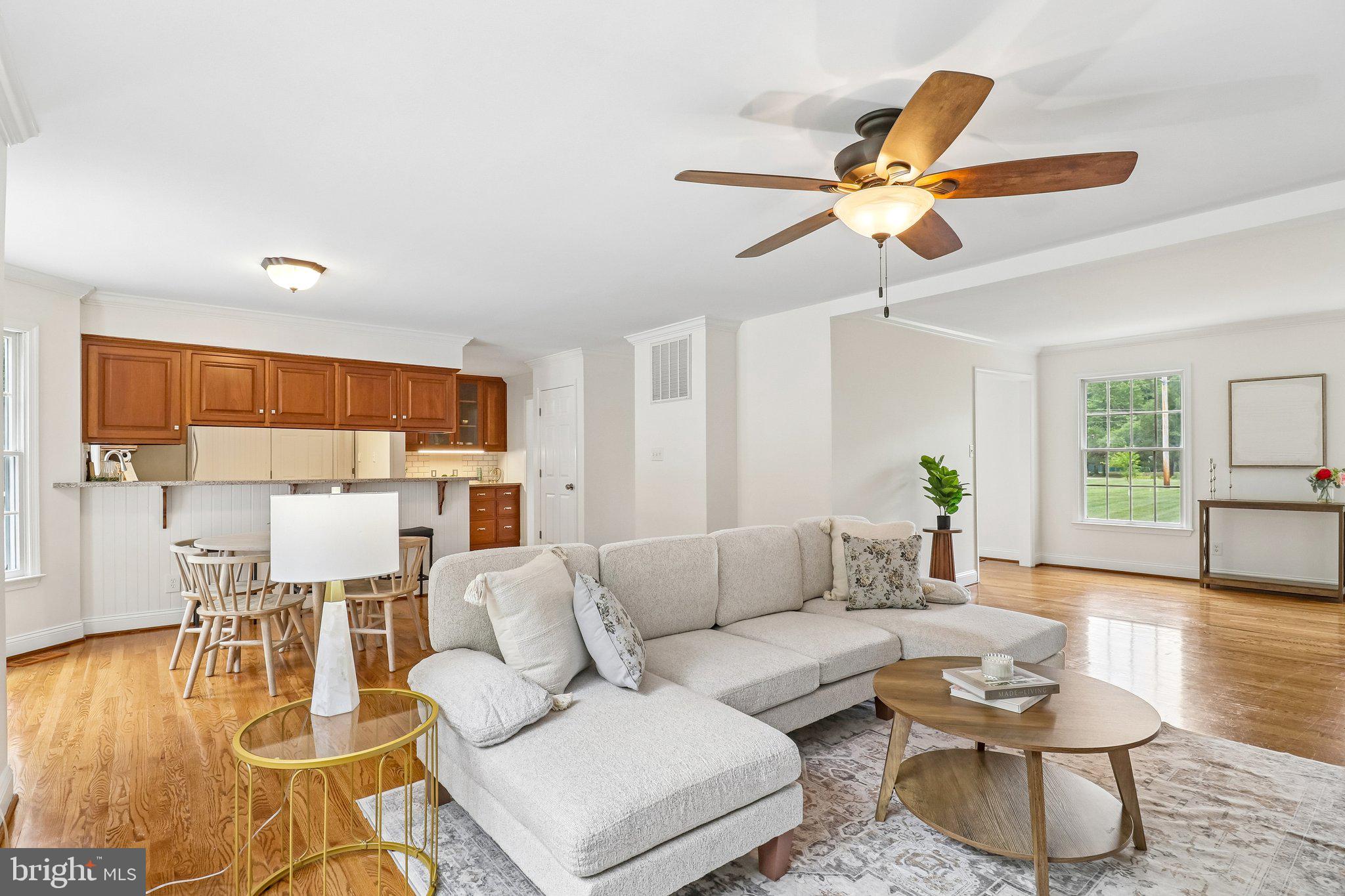 4940 Bryantown Road Waldorf, MD 20601 - Photo 11 of 102 Living room with dining area and fan