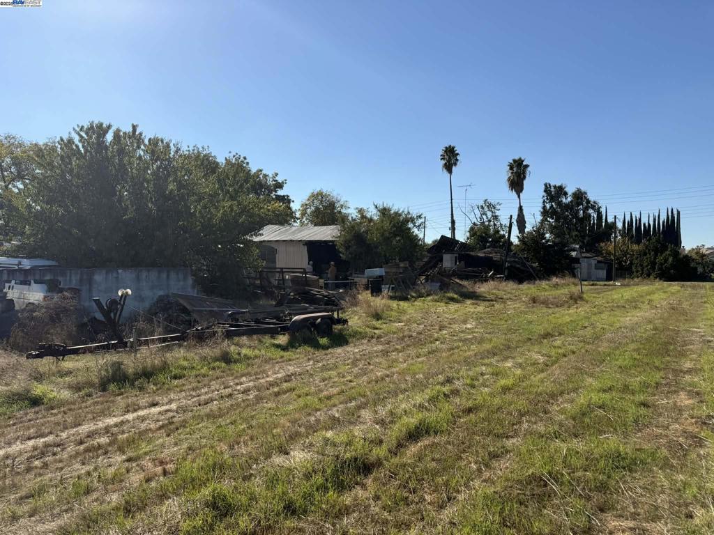124 Yosemite Meadows Drive Modesto, CA 95357 - Photo 13 of 13 a view of a house with backyard and sitting area