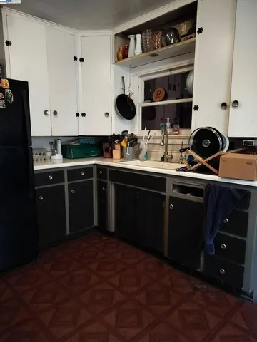 a kitchen with a sink and cabinets
