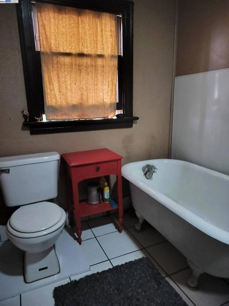 124 Yosemite Meadows Drive Modesto, CA 95357 - Photo 5 of 13 a bathroom with a toilet a sink and a window