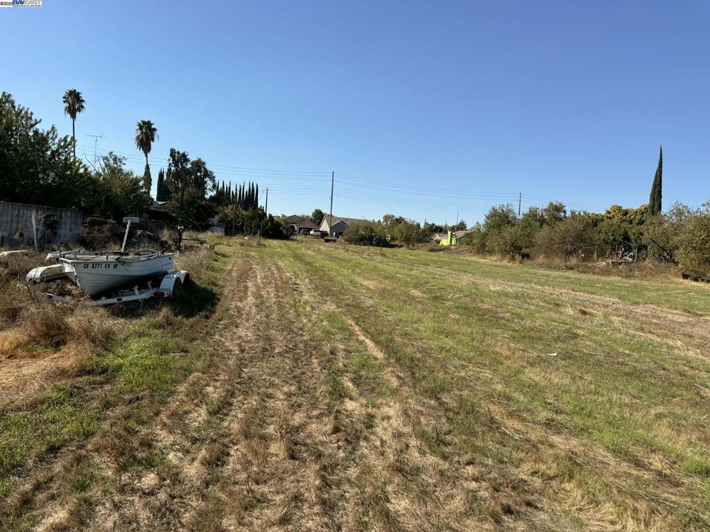 124 Yosemite Meadows Drive Modesto, CA 95357 - Photo 9 of 13 a view of a lake with houses