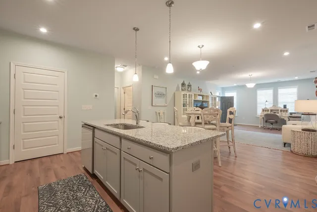 an aerial view of a house with a yard lake lake and outdoor seating