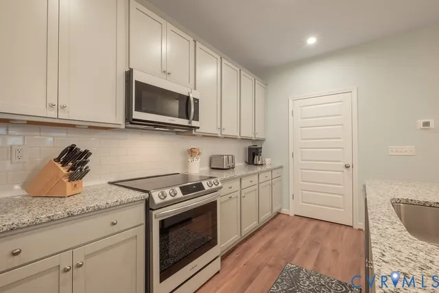 a view of a kitchen counter space and a sink