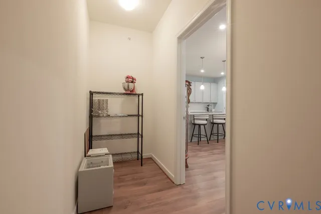 a kitchen with granite countertop a sink stainless steel appliances and cabinets
