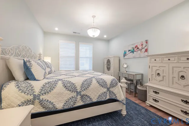 a bedroom with a bed and a dresser