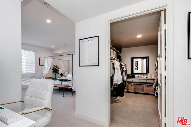a view of a livingroom with furniture and staircase