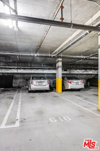 a view of parking garage with cars