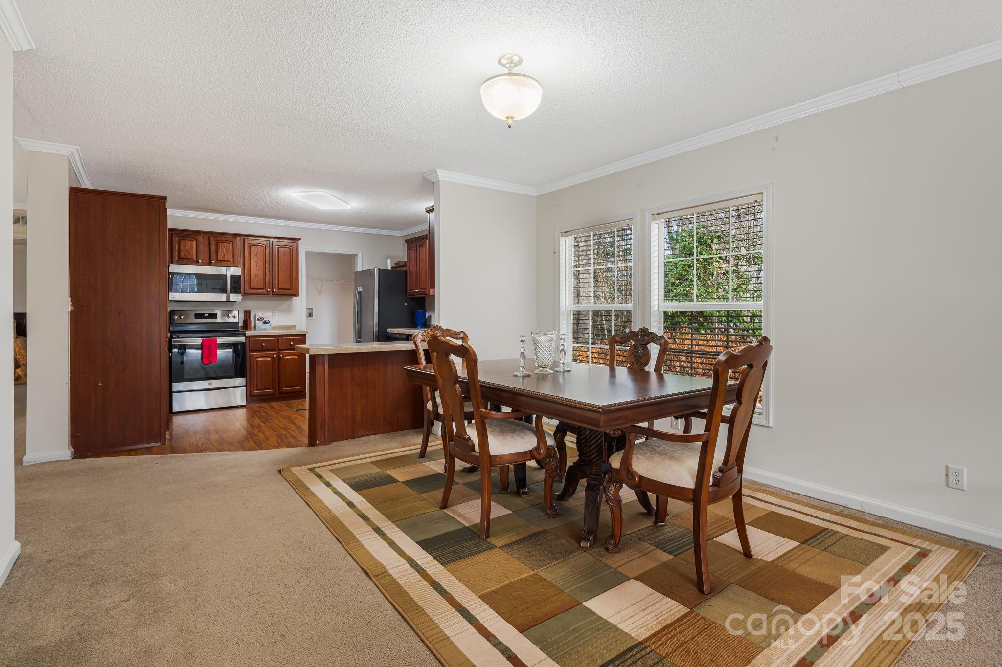 686 Sam Jones Road Burnsville, NC 28714 - Photo 16 of 41 a view of a dining room with furniture