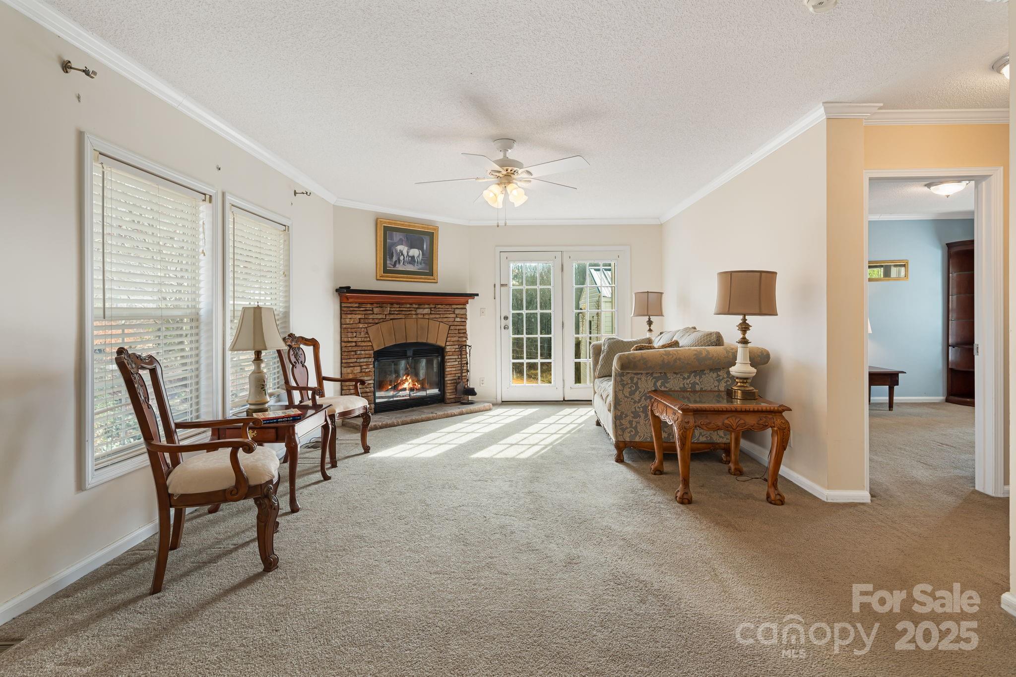 686 Sam Jones Road Burnsville, NC 28714 - Photo 17 of 41 a living room with furniture and a fireplace