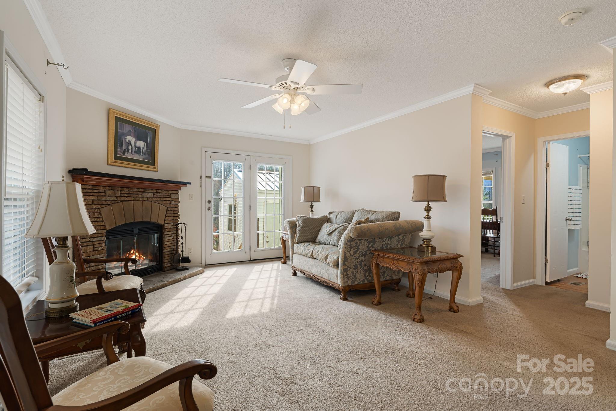 686 Sam Jones Road Burnsville, NC 28714 - Photo 18 of 41 a living room with furniture and a fireplace