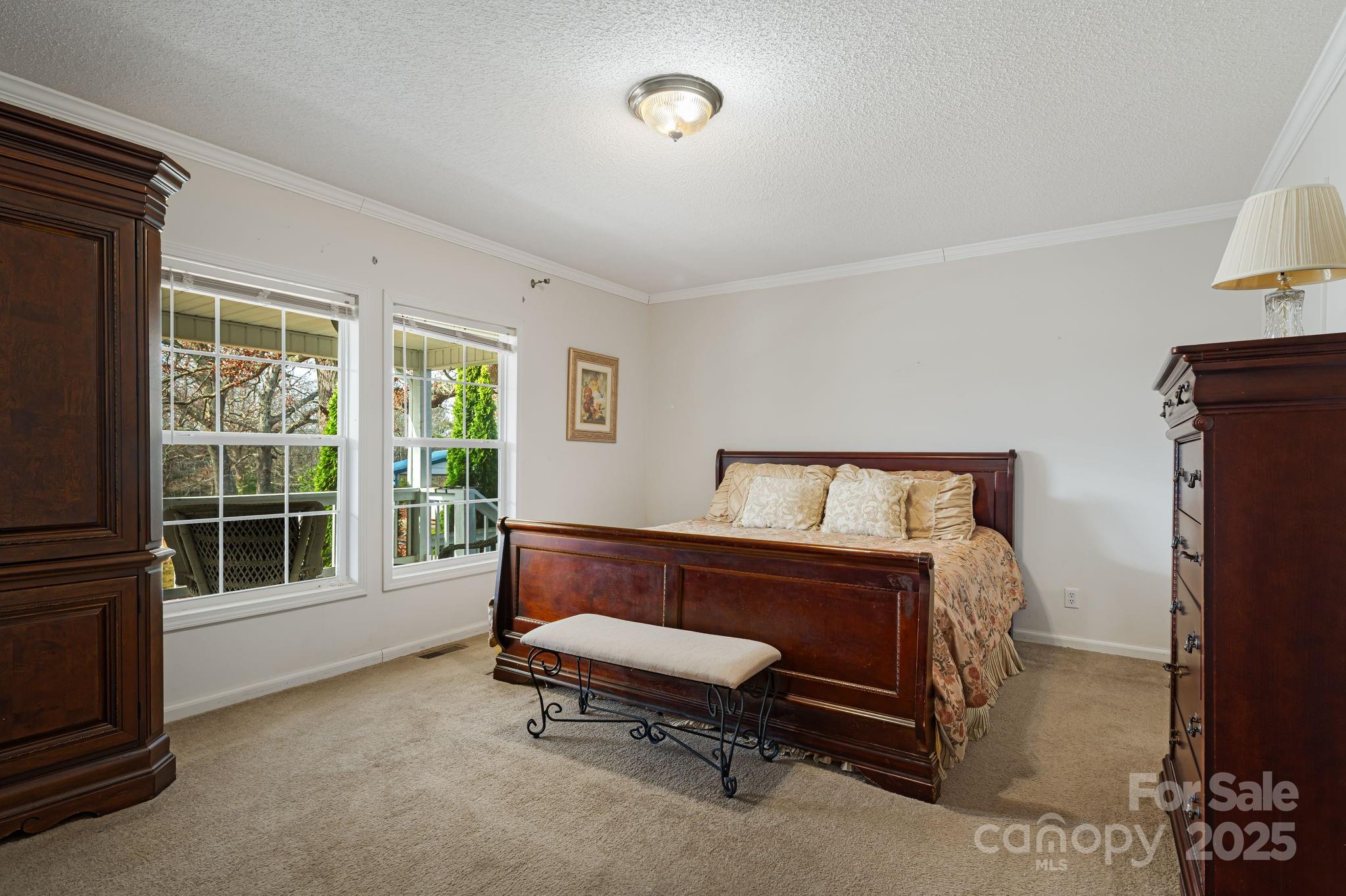 686 Sam Jones Road Burnsville, NC 28714 - Photo 25 of 41 a bedroom with a bed and a window
