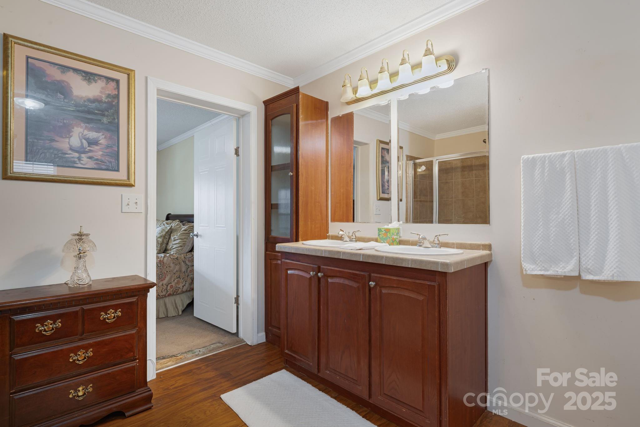 686 Sam Jones Road Burnsville, NC 28714 - Photo 28 of 41 a bathroom with a granite countertop sink and a mirror