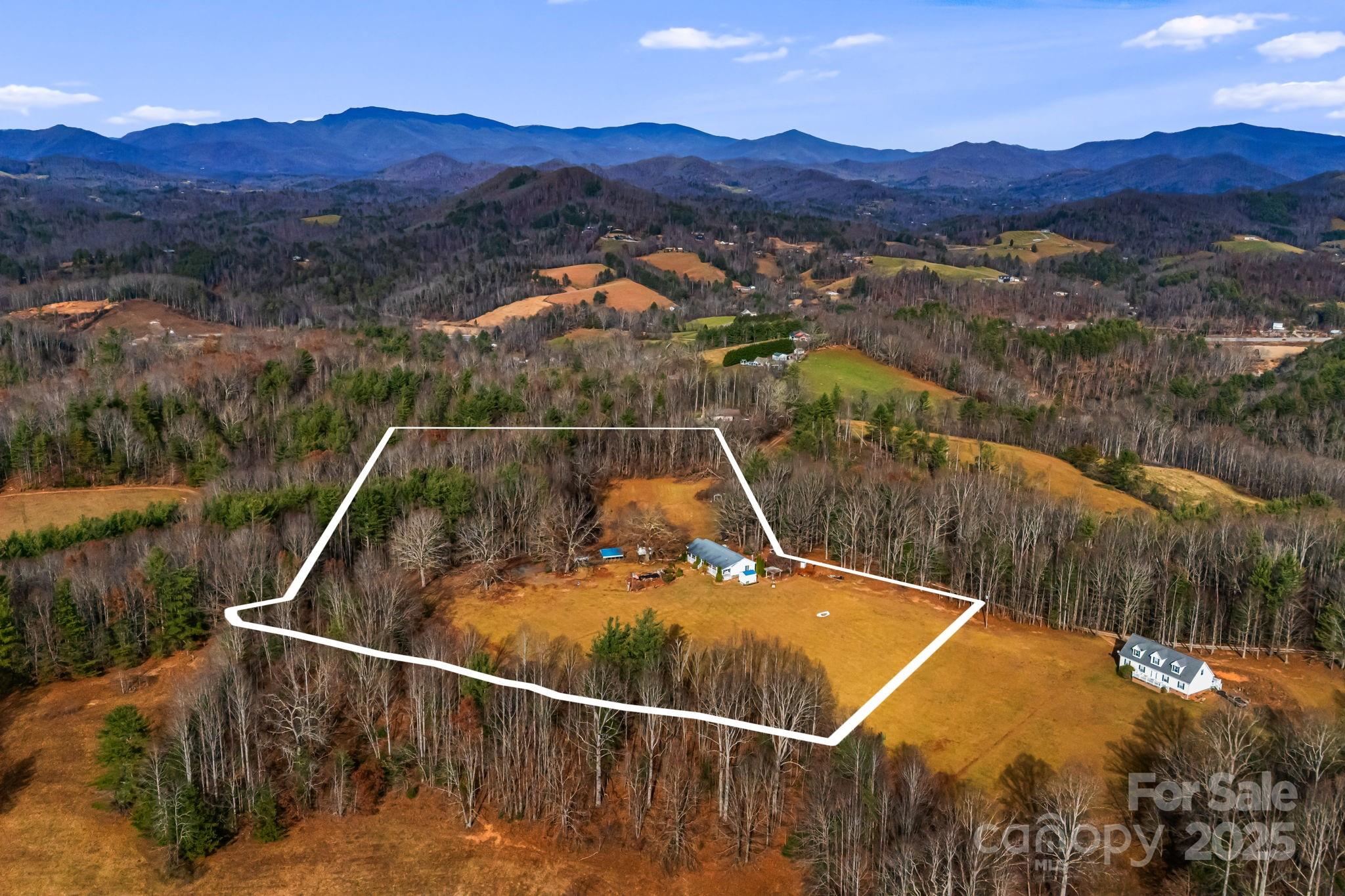 686 Sam Jones Road Burnsville, NC 28714 - Photo 33 of 41 a view of a small pool and a mountain view