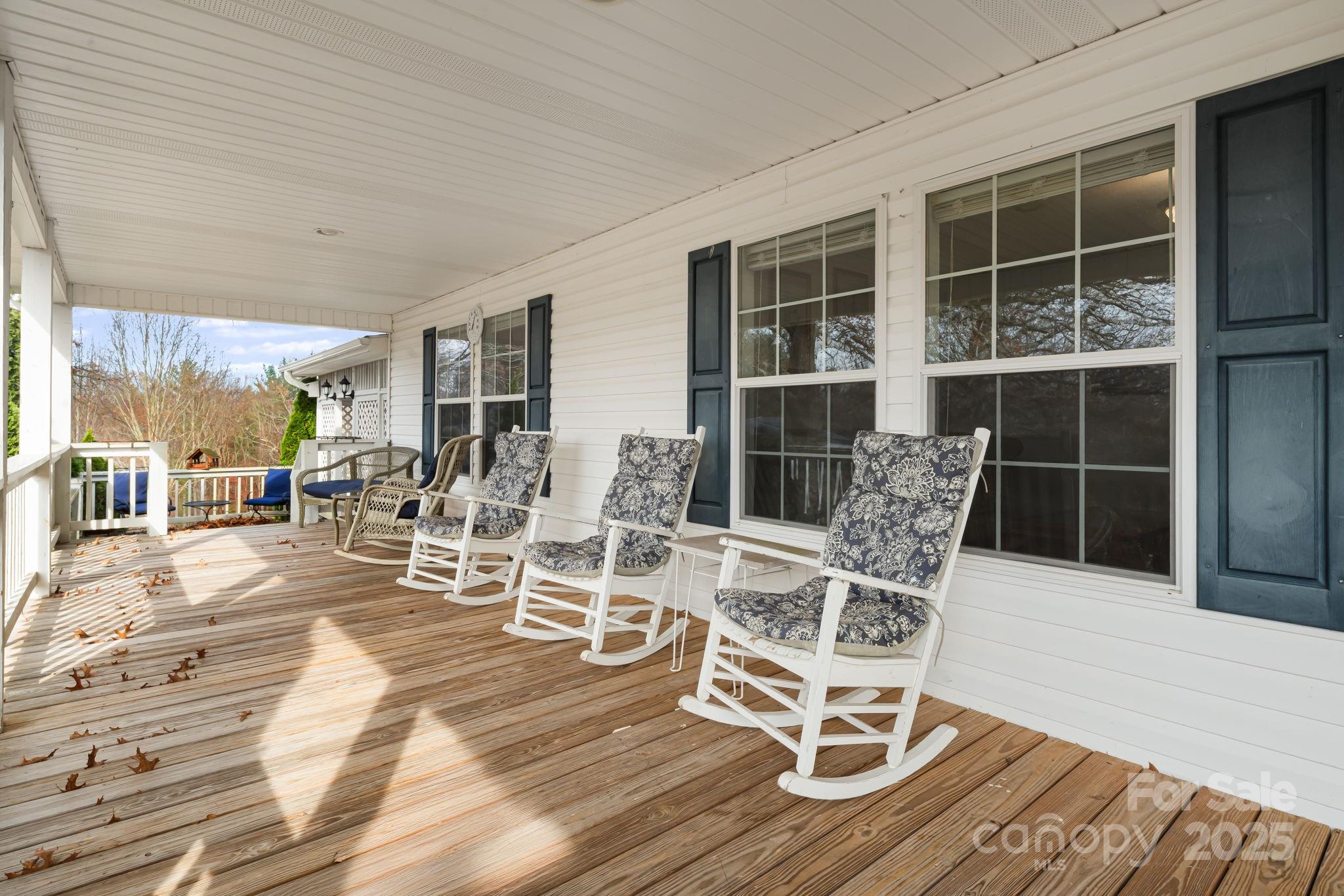 686 Sam Jones Road Burnsville, NC 28714 - Photo 6 of 41 a view of a patio with table and chairs