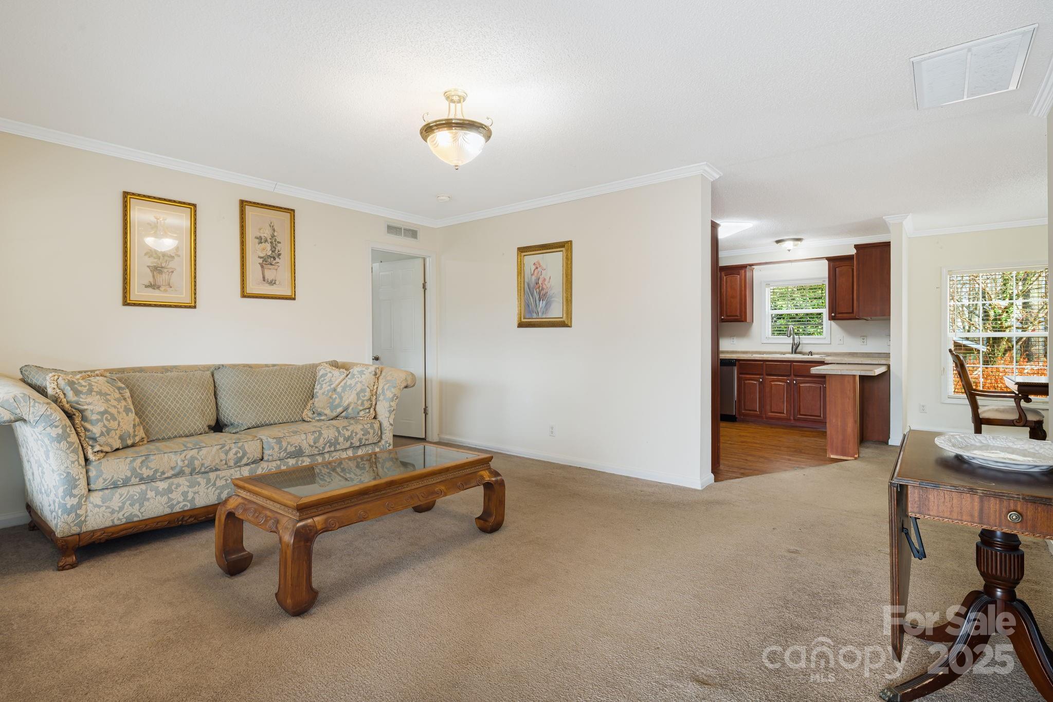 686 Sam Jones Road Burnsville, NC 28714 - Photo 8 of 41 a living room with furniture and a kitchen