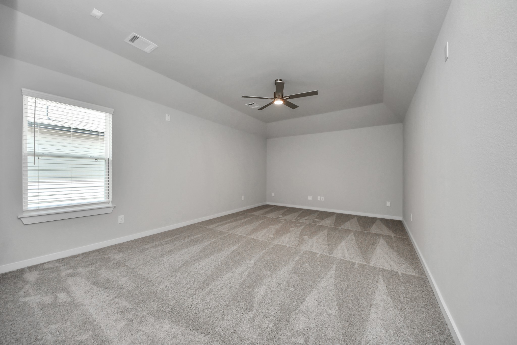 3110 Native Spg Drive Spring, TX 77373 - Photo 29 of 34 Secondary bedroom features plush carpeting, large windows that let in plenty of natural light, bright paint, and spacious closets. Sample photo of completed home with similar floor plan. Actual colors and selections may vary.