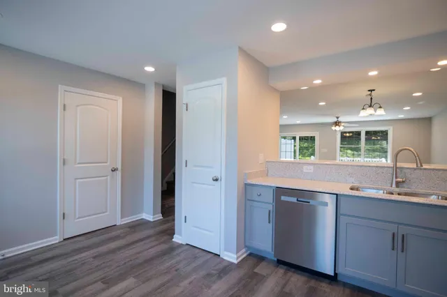 a view of a kitchen counter space with wooden floor