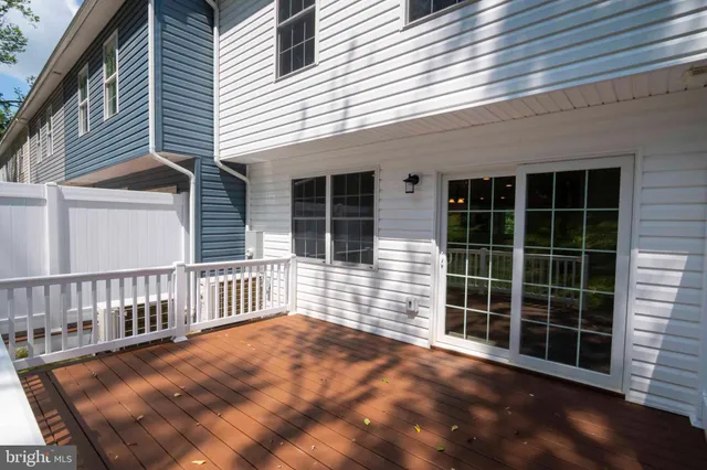 a view of a house with a large window and wooden floor