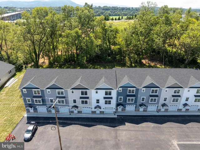 an aerial view of a house with a garden