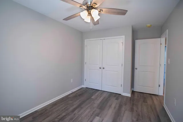 a view of an entryway with wooden floor