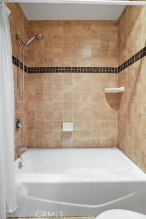 a bathroom with a shower and a bathtub