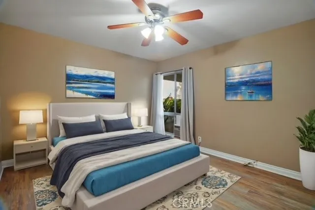 a bedroom with bed and a window