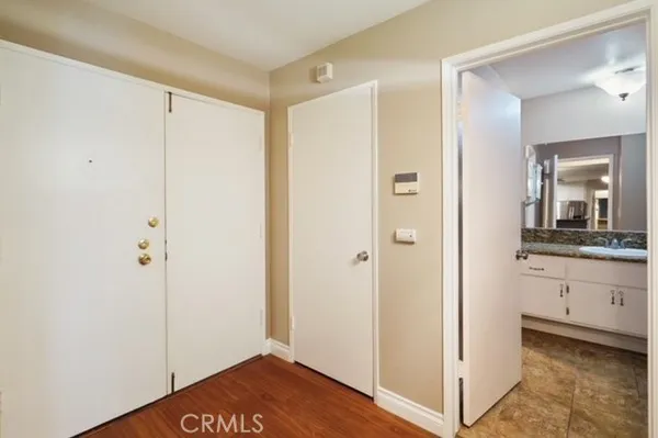 a view of a bathroom with sink mirror and shower
