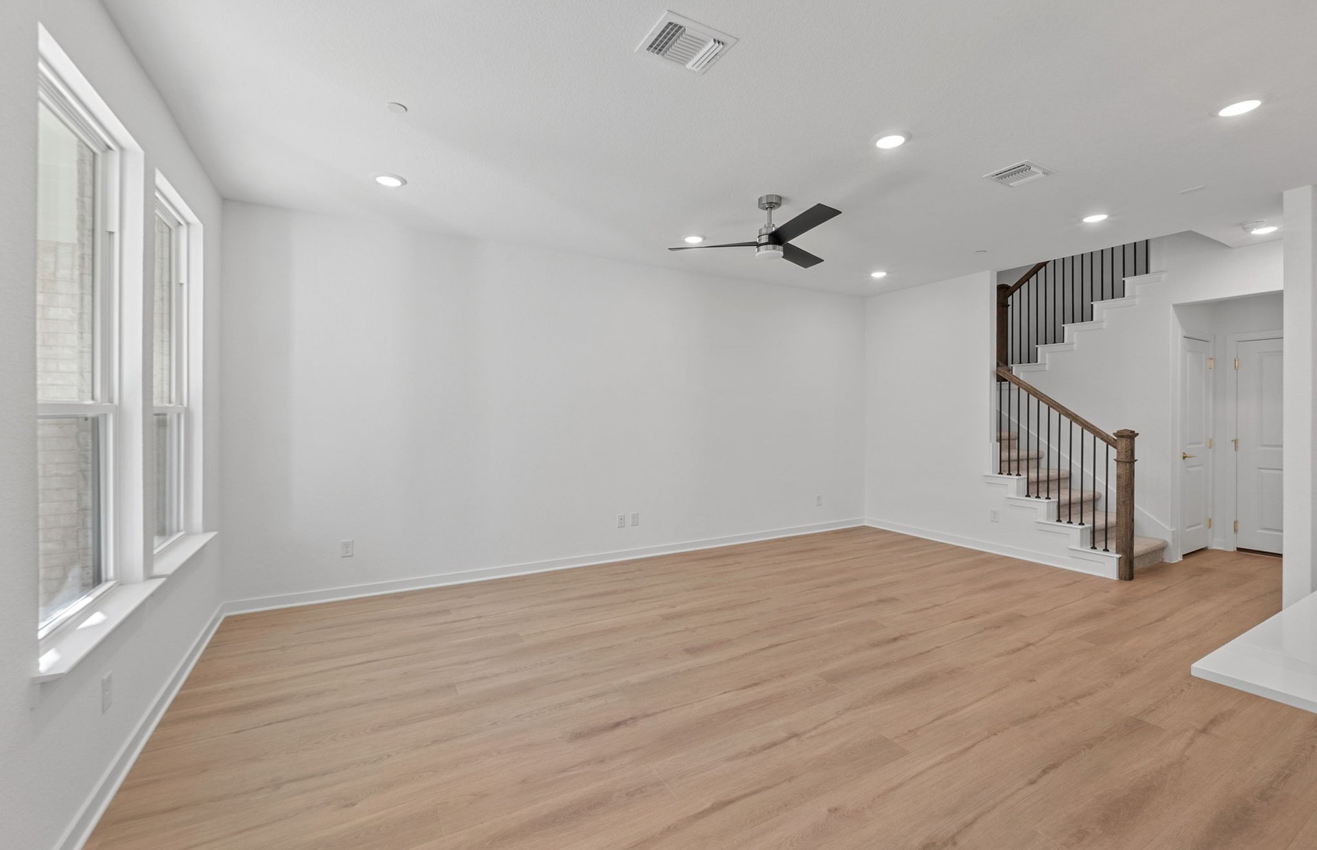1280 East Main Street, Unit 603 Round Rock, TX 78664 - Photo 9 of 28 wooden floor in an empty room with a window