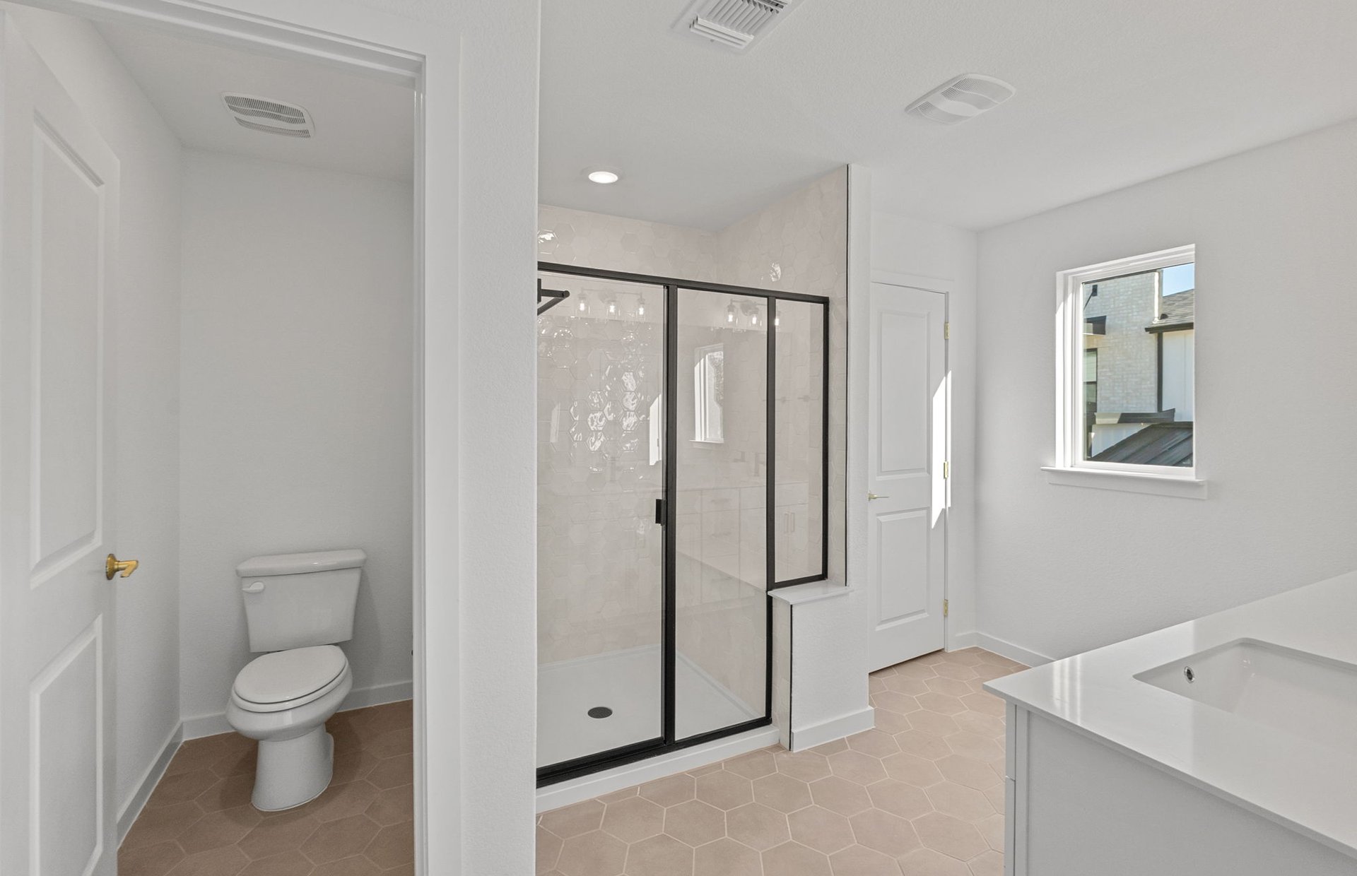1280 East Main Street, Unit 603 Round Rock, TX 78664 - Photo 15 of 28 a bathroom with a toilet sink and shower