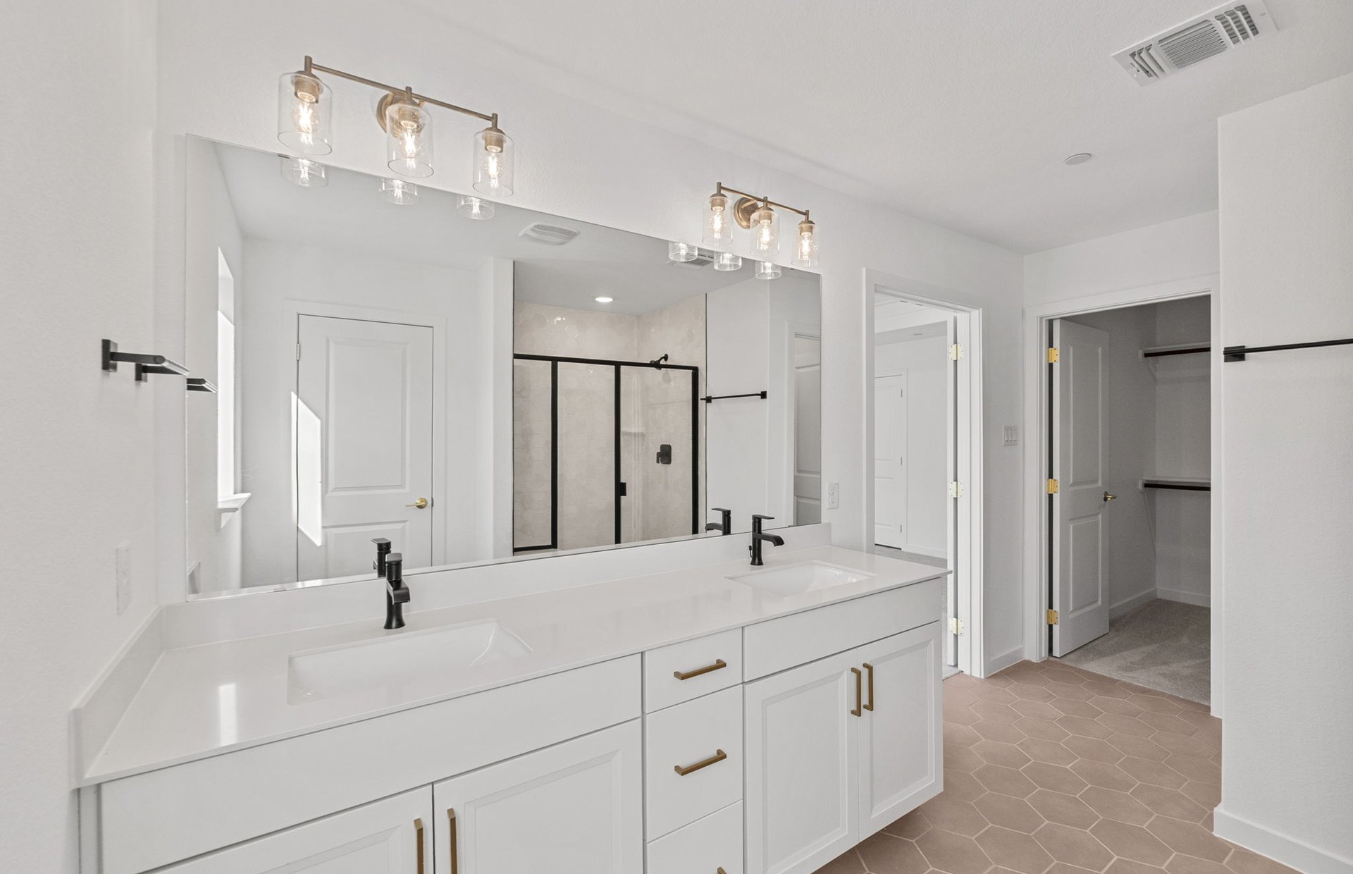 1280 East Main Street, Unit 603 Round Rock, TX 78664 - Photo 16 of 28 a bathroom with a double vanity sink mirror and