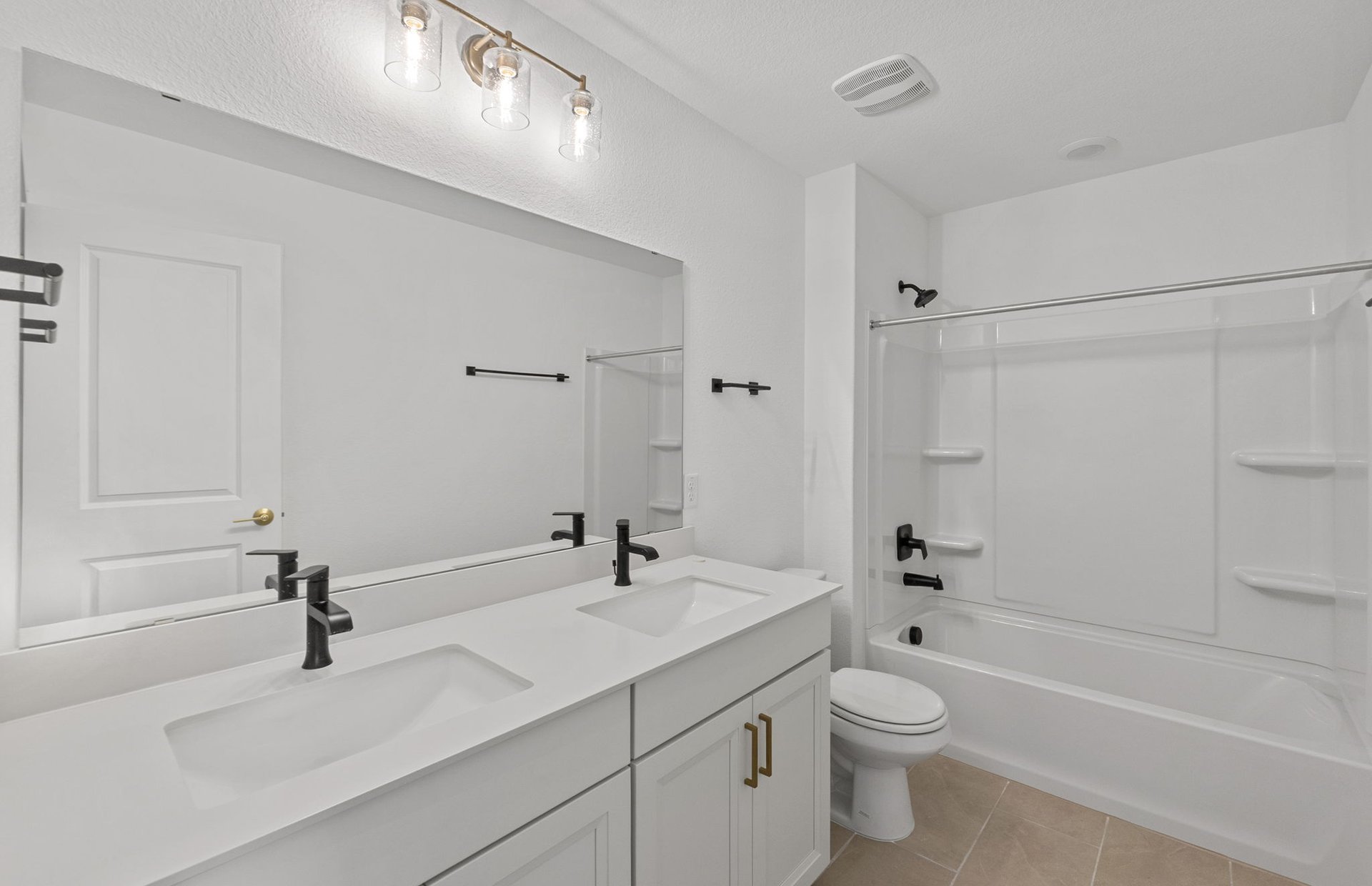 1280 East Main Street, Unit 603 Round Rock, TX 78664 - Photo 20 of 28 a bathroom with a sink a toilet and shower