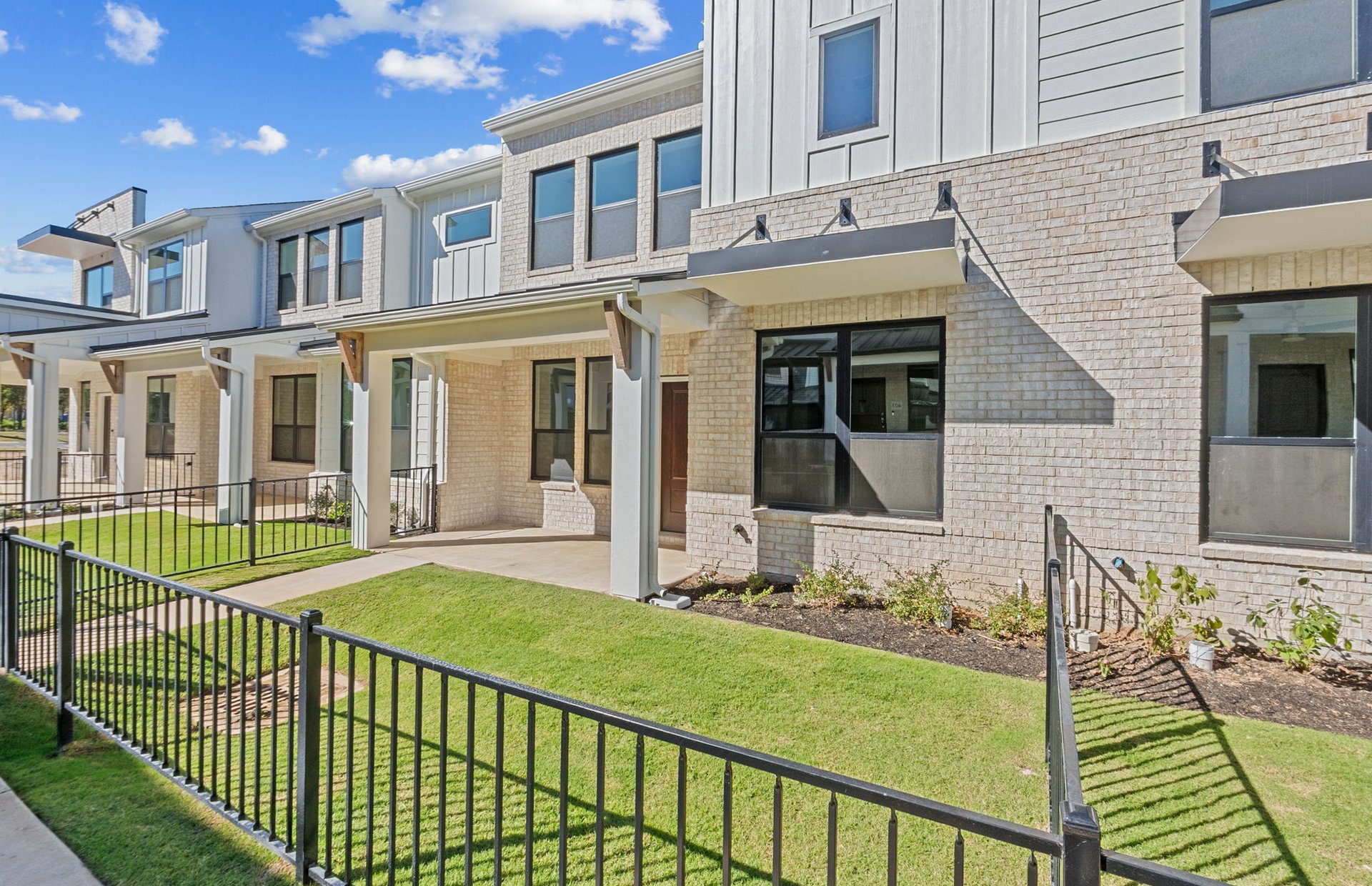 1280 East Main Street, Unit 603 Round Rock, TX 78664 - Photo 3 of 28 a view of a house with a backyard and porch