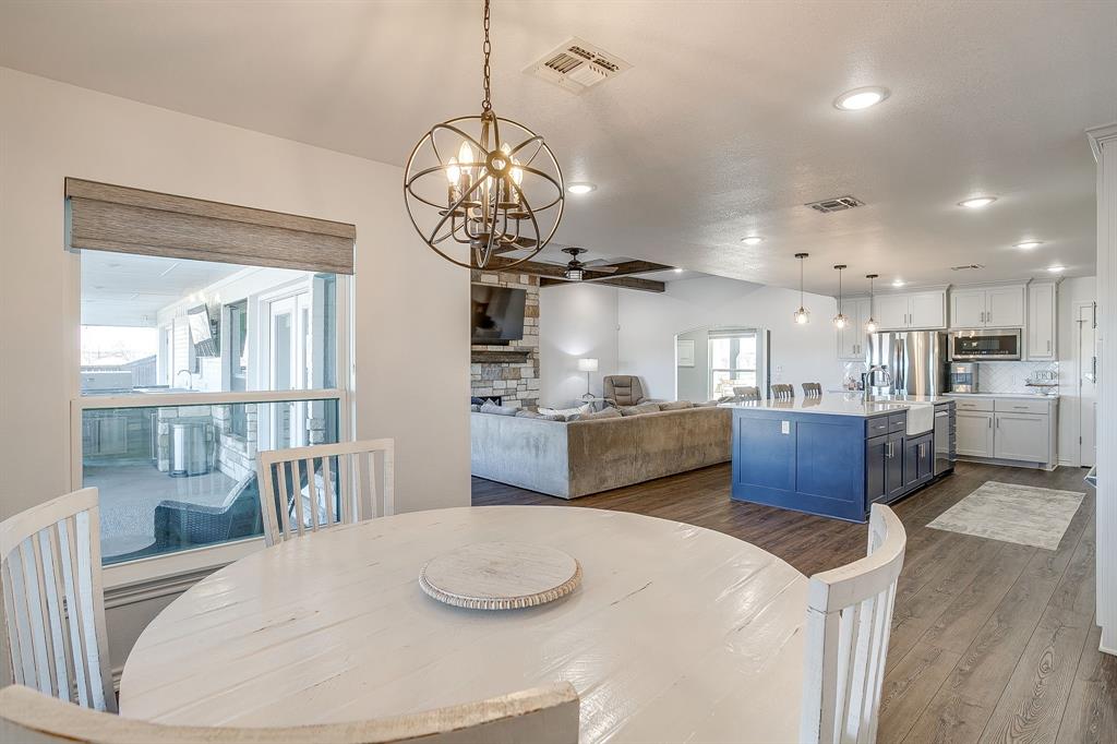 733 Fm 2652 Graham, TX 76450 - Photo 12 of 40 a kitchen with stainless steel appliances kitchen island a large island in the center